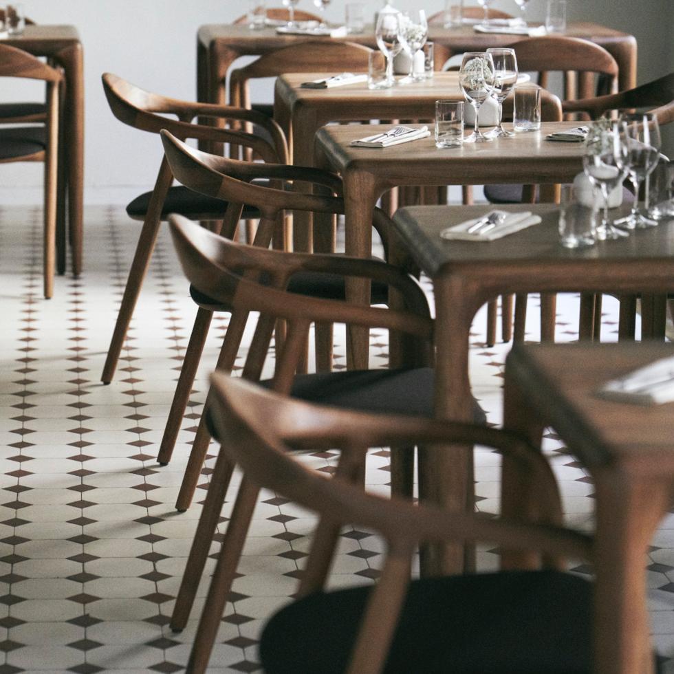 Artisan Neva Chairs & Latus Tables shown in walnut