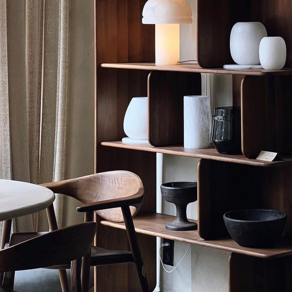 Artisan Soft Shelf shown in walnut with Naru armchair