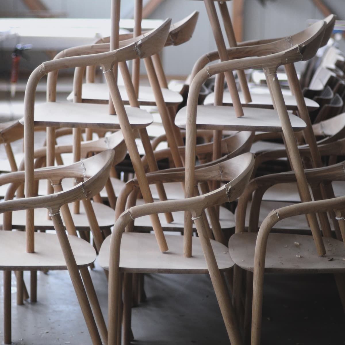 Artisan chairs, stacked in the workshop